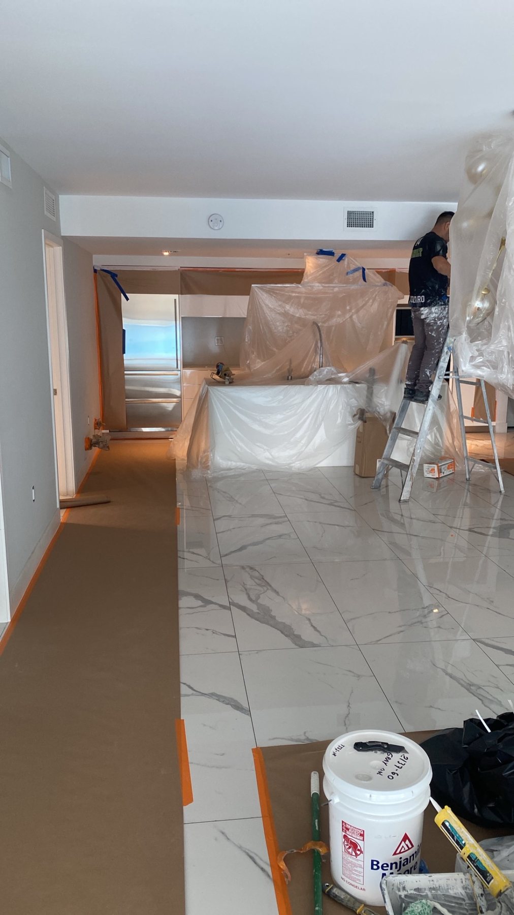 Painting professionals working in protected interior