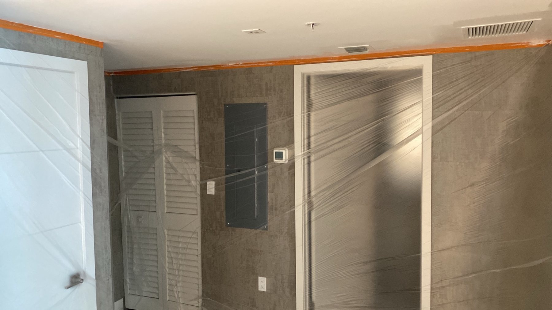 Walls and doors protected during Miami Beach painting project