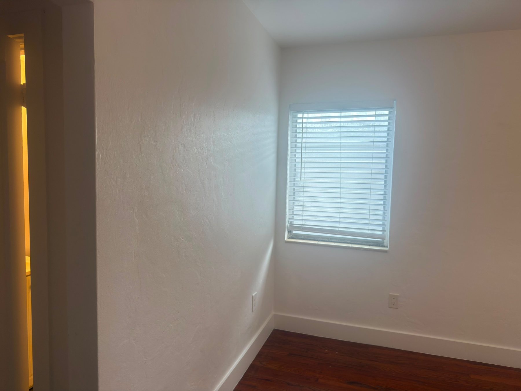 Bedroom corner after repairs and painting