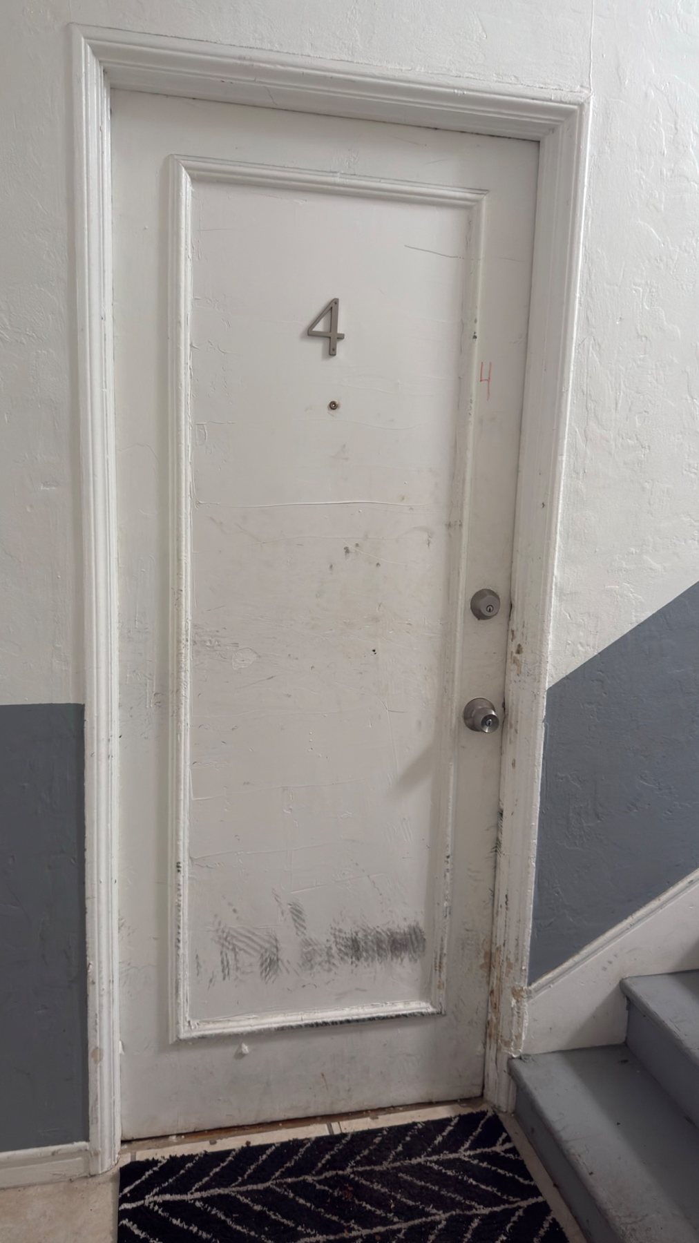 Entry door before repair and painting