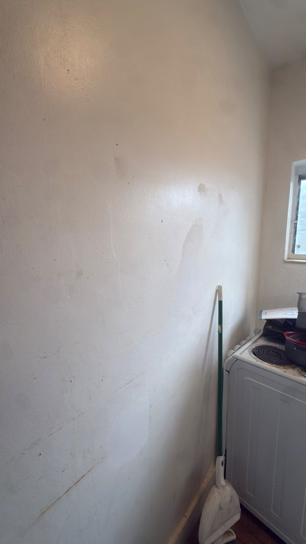 Kitchen wall before repair and painting